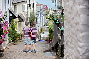 Beautiful family, walking on the streets of Clovelly, nice old village in the heart of Devonshire