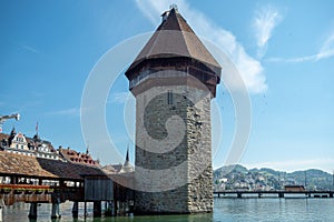 Beautiful famous stone tower at Chapel bridge on blue sky for backgrond