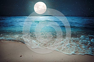 Beautiful fantasy tropical beach with star and full moon in night skies photo