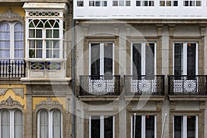 Beautiful fasade of the building in European style, small balconies.