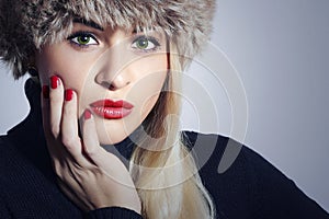 Beautiful Fashion Blond Woman in Fur. Beauty Girl. Winter Style. Red Manicure. Make-up