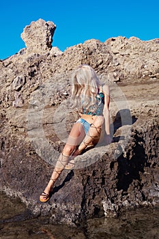 Beautiful fashion blonde at the seashore