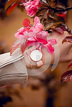 Beautiful fashion classic white watch on woman hand. Close-up photo