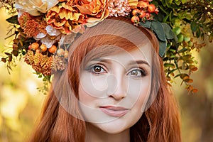 Beautiful fashion female with autumnal make up and red hair style