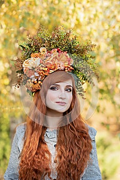 Beautiful fashion female with autumnal make up and red hair style