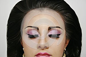 Beautiful fashion girl with closed eyes pinky eye shadows