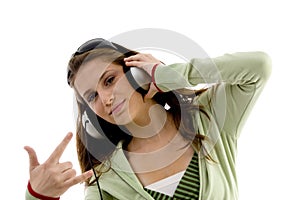 Beautiful fashion girl enjoying music