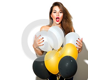 Beautiful fashion model girl with colorful balloons