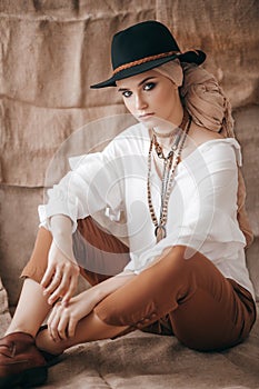 Beautiful fashion model posing in boho style clothes