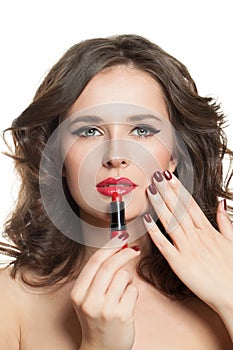 Beautiful fashion model woman with red manicured nails, lipstick and red lips make up portrait