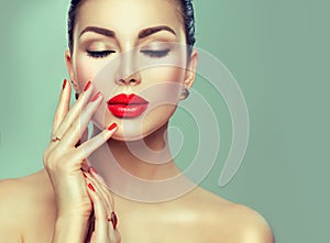 Beauty fashion woman with red lipstick and red nails