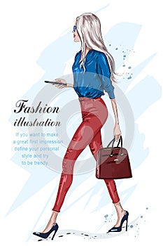 Beautiful fashion woman walking. Fashion stylish girl with accessories.