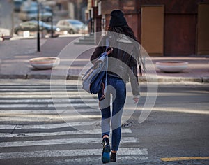 Beautiful fashion women with shopping bags. Trendy lifestyle urban portrait on city background