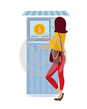 Beautiful fashionable girl stands near money terminal, for cashing funds.