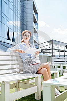 Beautiful fashionable remote worker having relaxing lunch break