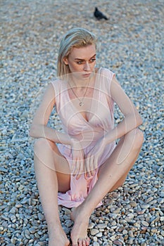 Beautiful fashionable woman in bathing suit on the Beach Ocean