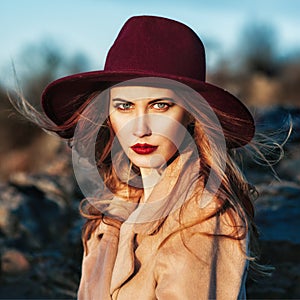 Beautiful fashionable woman wearing red hat