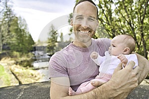 Beautiful father And Baby outdoors. Dad and her Child playing together
