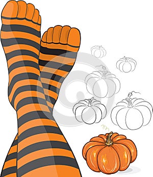 Beautiful feet in stripy socks with pumpkin