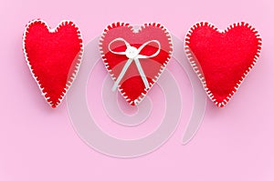 Beautiful felt hearts and concrete background. Love symbol and copy space, Valentines Day background. Couple threesome