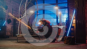 Beautiful Female Artist Uses an Angle Grinder to Make Brutal Metal Sculpture in Studio. Tomboy Gir