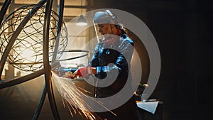 Beautiful Female Artist Uses an Angle Grinder to Make Brutal Metal Sculpture in Studio. Tomboy Gir