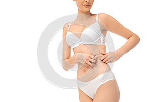 Beautiful female belly and chest isolated on white background. Beauty, cosmetics, spa, depilation, treatment and fitness