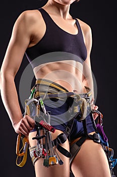 Female body in climbing equipment