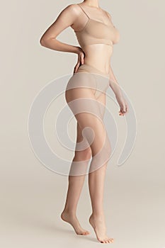 Beautiful female body on white background. Beauty, cosmetics, spa, depilation, diet and treatment, fitness concept.