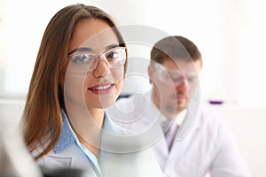 Beautiful female chemist doctor portrait goggles in laboratory