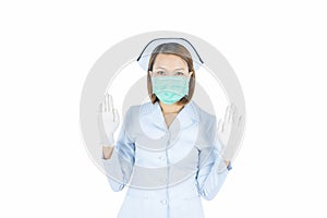 Beautiful female doctor or nurse wearing protective mask and latex or rubber gloves isolated on white background.