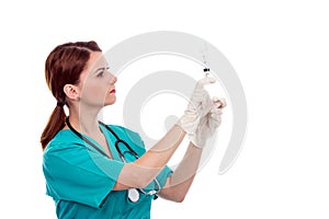 Beautiful female doctor preparing syringe