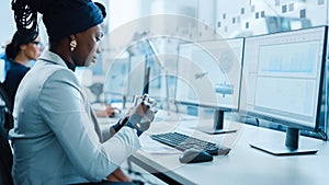 Beautiful Female Engineer Working on Personal Computer in the High-Tech Industrial Facto