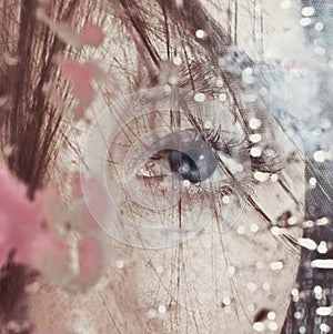 Beautiful female eye through the dirty glass