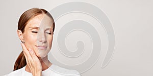 Beautiful female face closeup on white banner background