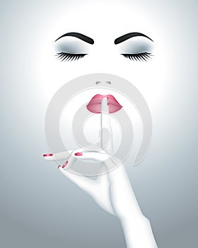 Beautiful female face with finger on her lips photo