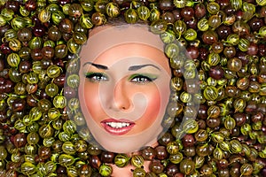 Beautiful female face in gooseberry