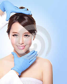 Beautiful female face with Plastic surgery glove