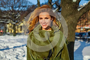 Beautiful female face. Winter woman outdoors