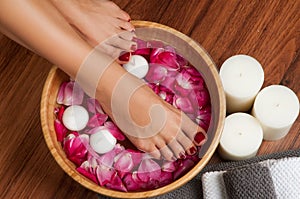 Beautiful female feet at spa salon on pedicure procedure.