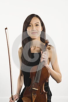 Beautiful Female With Fiddlestick And Violin photo