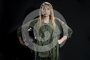 Beautiful Female Fighter Pilot Wearing A Flightsuit And Holding A Helmet In A Studio Environment