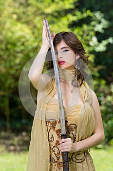 Beautiful female fighter with a sword