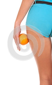 Beautiful female figure with an orange.