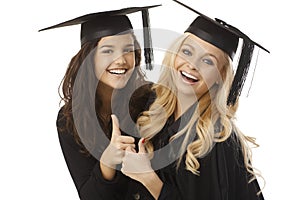 Beautiful female graduates showing ok sign