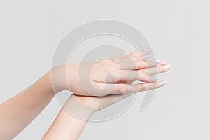 Beautiful female hand, female hand applying lotion or hand cream to hand care in spa and manicure concept