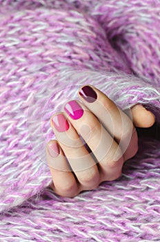 Beautiful female hand with pink nail design