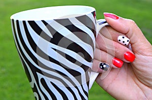 Beautiful female hand with red nail design