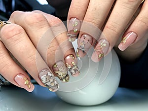 Beige manicure with fashionable design