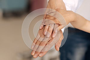 Beautiful female hands being put on each other